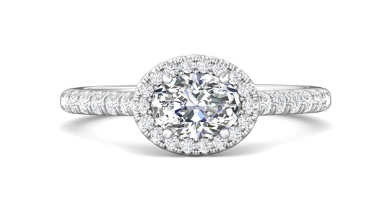 a white gold halo engagement ring featuring a horizontally set oval diamond
