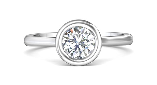 a white gold bezel set engagement ring with a round cut diamond