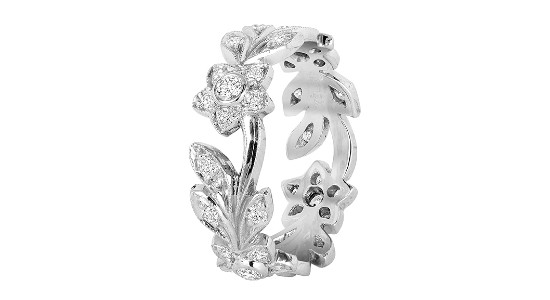 a platinum fashion ring featuring floral and vine details and diamond accents