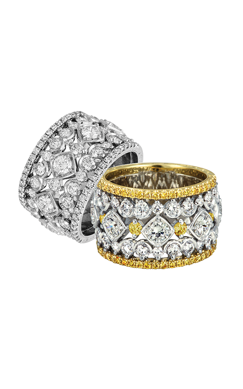 Close-up of two ornate rings, one features intricate diamond patterns with a silver finish. The other mixes silver and gold, sparkling with numerous diamonds