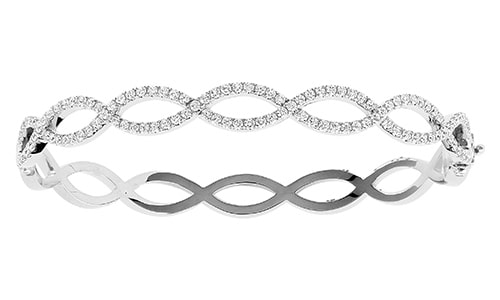 A white gold, intertwining diamond bangle from Jack Kelege.