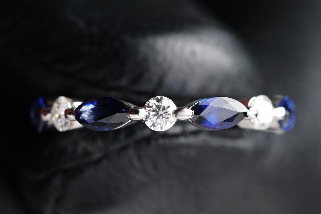 a white gold wedding featuring marquise cut sapphires and round cut diamonds
