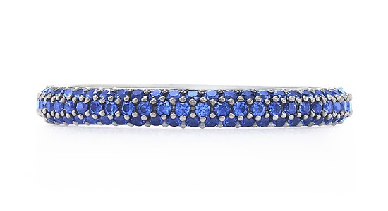 a silver, stackable fashion ring featuring rows of tiny sapphires