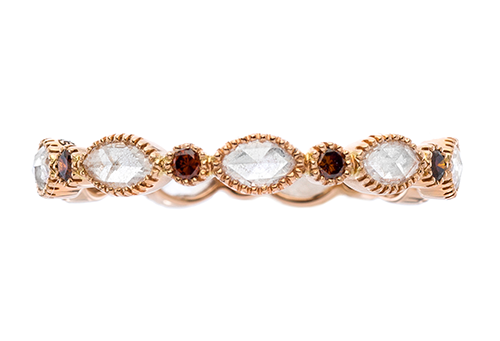 A rose gold fashion ring with alternating marquise cut diamonds and round rubies