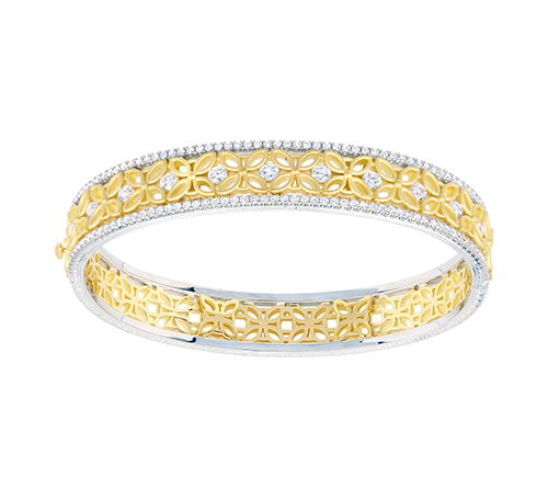 A white and yellow gold diamond ornate bangle