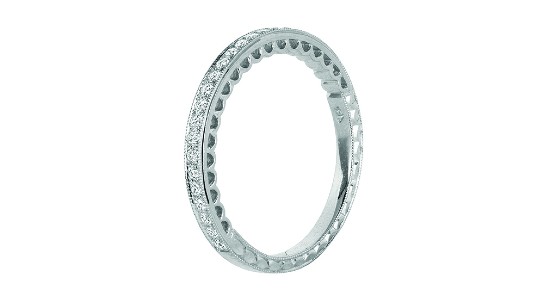 a white gold wedding band featuring channel set diamonds and milgrain details