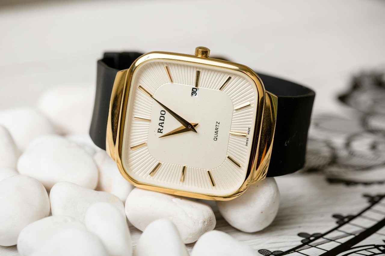 A luxurious wrist watch with a square case.