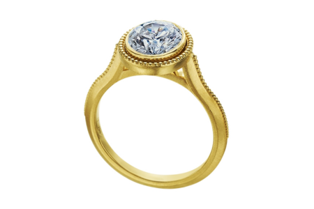 A bezel-set engagement ring from Mark Patterson, available at Frank Adams Jewelers.