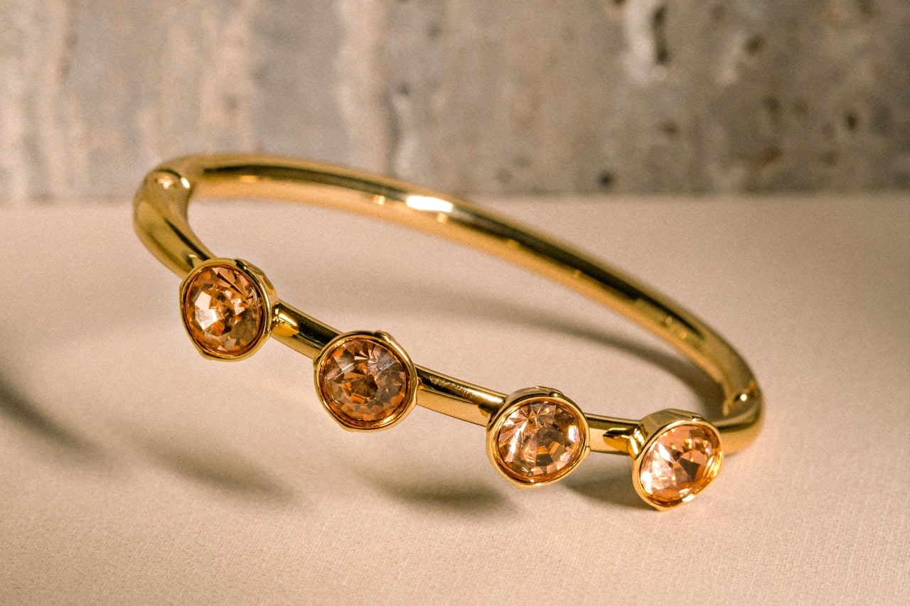 a yellow gold fashion ring featuring four citrine stones a yellow gold fashion ring featuring four citrine stones