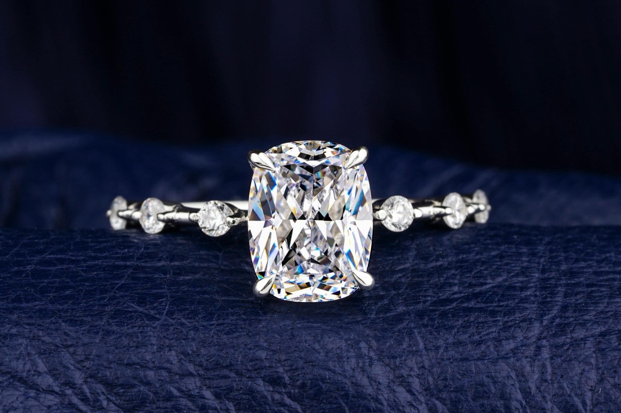 a unique engagement ring with a large center stone and side stones a unique engagement ring with a large center stone and side stones